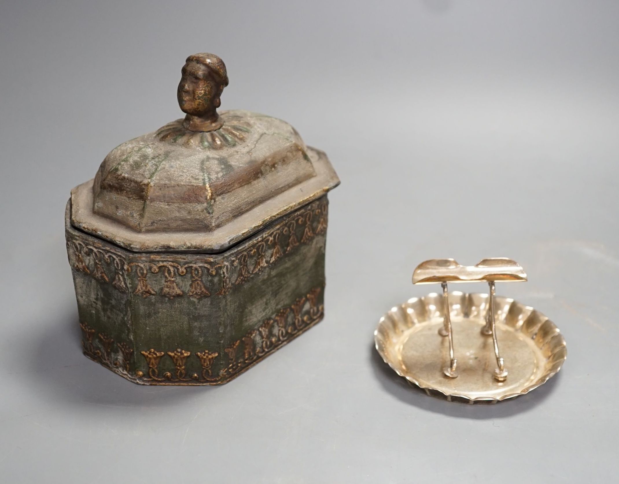 A Regency octagonal lead tobacco box, weight and cover, with slave-head finial, 14cm tall, and late Victorian silver cigarette holder